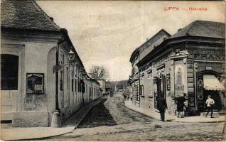 1913 Lippa, Lipova; Híd utca, Schwarz Ferenc üzlete. Özv. Krivány Györgyné kiadása / street view, shop + &quot;TÖVIS - ARAD - BUDAPEST 5 C&quot; vasúti mozgóposta bélyegző (EK)