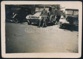 cca 1940 Katona Krupp Protze német tüzérségi vontató teherautó előtt, II. világháborús fotó, 9x6 cm / Soldier in front of Krupp Protze German truck, artillery tractor, WWII photo