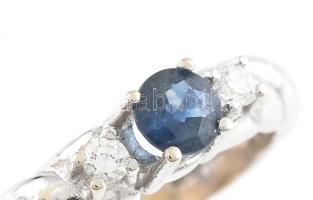 Arany (Au/14k) fehérarany gyűrű zafírral és briliánsokkal ékített, m: 55, bruttó: 3,8g