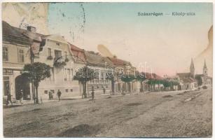 Szászrégen, Reghin; Közép utca, Theil üzlete. Vasúti levelezőlapárusítás 2399. / street view, shops + 1940 Szászrégen visszatért So. Stpl. (ázott / wet damage)