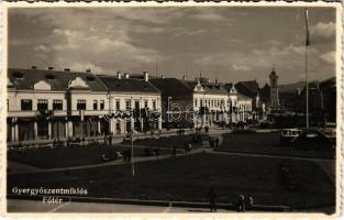 1940 Gyergyószentmiklós, Gheorgheni; Fő tér bevonulási díszben, országzászló, "Éljen Horthy Miklós" és "Magyarország feltámadott" feliratok, Munkásbiztosító / main square during the entry of the Hungarian troops, flag + So. Stpl (EK)