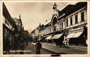 Nagyvárad, Oradea; Rákóczi út, City illatszertár, Polgári bútorüzlet, fodrászat, Vidor Manó, Davidovics István üzlete, Norma cipőüzlet, Hangya szövetkezet, villamos / street view, shops, tram (r)