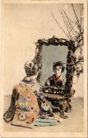 Japanese geisha in front of the mirror / Japán gésa tükör előtt