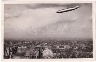 ~1930 Budapest V. Erzsébet híd pesti hídfő a rakparti palotákkal, fölöttük a Graf Zeppelin LZ-127 léghajó. photo