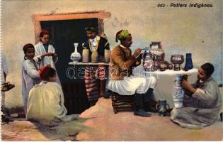 Potiers indigénes / Tunisian folklore, pottery makers, from postcard booklet (small tear)