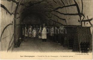 La Champagne. Travail du Vin de Champagne, La mise sur pointe / champagne factory, interior with wor...