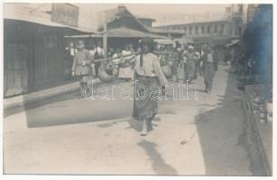 1918 Bucharest, Bukarest, Bucuresti, Bucuresci; woman carrying jugs on the street, folklore, German soldier. Max Steckel photo