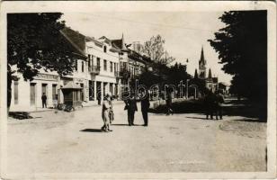 1938 Munkács, Mukacheve, Mukachevo, Mukacevo; utca, Zipszer Adolf üzlete, büfé, kerékpár, templom / street view, shops, buffet, bicycle, church + "1938 Munkács visszatért" So. Stpl. (fl)