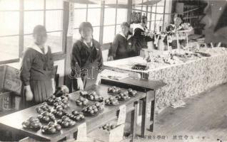 Schoolgirls selling apple
