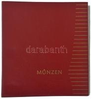 Piros "MÜNZEN" feliratú érmetartó album 7 darab berakólappal, összesen 148 férőhellyel, különböző méretű érmék számára. Használt, jó állapotban.