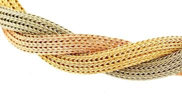 Arany-fehérarany (Au/14k) fonott karkötő, három különböző színnel. Jelzett, 18 g, h: 19 cm. Dobozban