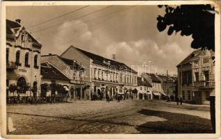 1937 Siklós, utca részlet, Illatszertár, Lázár R. üzlete, Siklósi Takarékpénztár, Sebők Ferenc üzlete, Gyógyszertár. Kiadja Monostory György (fa)