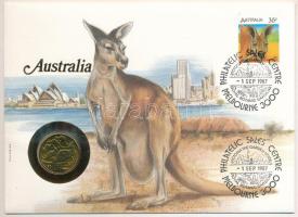 Ausztrália 1985. 1$ Al-Br "A Dollár 10. évfordulós kiadása" érme felbélyegzett borítékban, első napi bélyegzéssel, német nyelvű tájékoztatóval T:UNC Australia 1985. 1 Dollar Al-Br coin in envelope with stamp, first day cancellation and a prospectus in german C:UNC