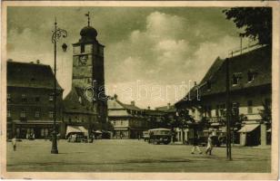 Nagyszeben, Hermannstadt, Sibiu; Ferdinánd király tér, Mathias Schöger üzlete, autóbuszok. Krafft & Drotleff / Piata / square, shops, bus