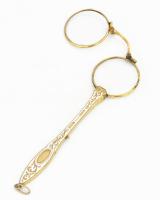 Lornyon. Díszes, aranyszínű fém keret és nyél, fehér zománcberakással. Jelzett: D.R.G.M. 736847. Gom...