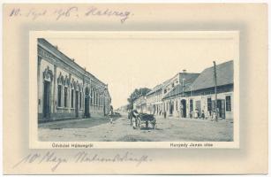 Hátszeg, Hateg; Hunyady János utca, Hunyady szálloda, Pilseni sörcsarnok, cementárugyár üzlet. Sbuchea Miklós kiadása / street, hotel, beer hall, shop