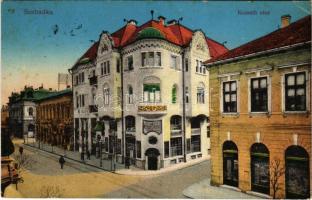 1915 Szabadka, Subotica; Kossuth utca, Takarékpénztár, kávéház, Fonciere biztosító társaság, üzletek. Vasúti levelezőlapárusítás 16. sz. 1915. / street view, savings bank, insurance company, café, shops (EK)