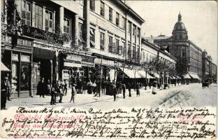 1899 (Vorläufer) Budapest V. Károly körút, Heller Móric üzlete, Adler könyvesboltja, fodrász. Kiadja Schmidt Edgar (EK)