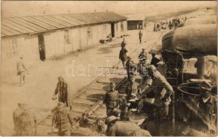 Első világháborús osztrák-magyar katonai tábor a vasútállomásnál, ételosztás / WWI K.u.k. military camp at the railway station, food distribution among the soldiers. photo