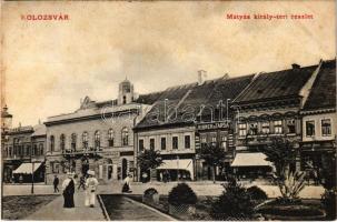 1911 Kolozsvár, Cluj; Mátyás király tér, Szabó Győző, Kováts P. fiai, Ribner és társa, Lepage Lajos és Csap József üzlete, gyermek ruha üzlet, kávéház. Fabritius Erik és társa kiadása / square, shops, cafe (fl)