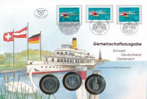 Ausztria / Németország / Svájc 1993. "Közös kiadás - Boden-tó" érmés boríték első napi bélyegzéssel és bélyeggel, ismertetővel, benne Ausztria 1989. 10Sch, Németország 1992D 1M, Svájc 1992B 2Fr T:1 Austria / Germany / Switzerland 1993. "Joint issue - Bodensee" coins in envelope with first day stamps and information, with Austria 1989. 10 Schilling, Germany 1992D 1 Mark, Switzerland 1992B 2 Francs C:UNC