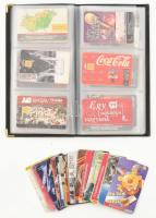 66 db vegyes telefonkártya, egy részük albumban