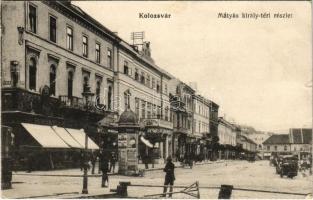 1916 Kolozsvár, Cluj; Mátyás király tér, hirdetőoszlop, Schuster Emil üzlete, Mezőgazdasági Bank, Hanitz Sándor könyvkötészete / square, advertising column, bank, book shop