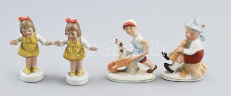 4 db porcelán figura: kisfiú talicskával, fuvolázó fiú, táncoló lánykák. Kézzel festett, részben jelzett, változó állapotban, m: 8 - 9 cm