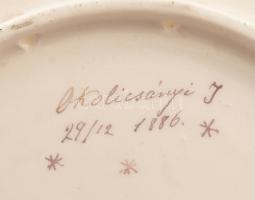 1886 Schütz Cilli virágmintás falitál, tulajdonosi jelzéssel: "Okolicsányi J. 29/12 1886"....