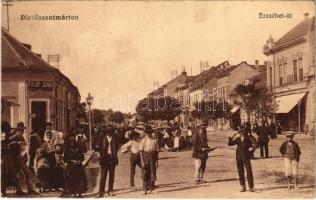 Dicsőszentmárton, Tarnaveni, Diciosanmartin; Erzsébet út, piac, Fülöp Jenő üzlete, tetőépítés. Weissburg tőzsde kiadása / street, shop, market roof construction