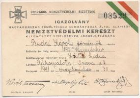 1941. "Nemzetvédelmi Kereszt" kitüntetéshez névre szóló, kitöltött, sorszámozott viselői igazolvány az "Országos Nemzetvédelmi Bizottság" szárazpecsétjével, szép állapotban, kis folt