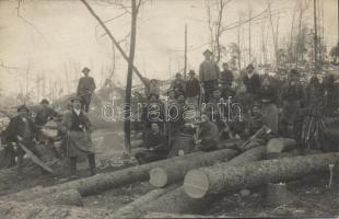 Soldiers working with lumberjacks photo