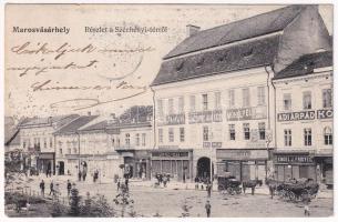 1908 Marosvásárhely, Targu Mures; Széchenyi tér, Adi árpád könyvkiadó, Engel J. Frigyes, Reichardsperg J. és társa, Nagy József, Lőrincz és Oláh, Hajdú Sándor, Kiss Antal, Reményi Bazár, Kőszegi Antal, Magyari és Heszke József üzlete, Hitelszövetkezet faipari szakcsoportjának közös műhelyei, Koronás takarékszövetkezet, Szakáts Gábor cukrászata, román cement. Hirsch Mór kiadása / square, shops, confectionery, savings bank (EK)