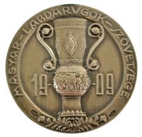 1931. "Magyar Labdarúgók Szövetsége" kétoldalas, jelzett Ag díjérem, hátoldalán "II. díj 1930-31" gravírozással és "SGA" gyártói jelzéssel. A Magyar Kupa 1930-1931-es idényében a III. Kerület és a Ferencváros jutott a döntőbe. Mindkét csapat a profi elsőosztályú ligában szerepelt, ahol a Fradi a 3., míg az óbudai csapat a 6. helyen végzett. A kupadöntőben hiába a zöld-fehérek voltak az esélyesebbek, a kék-fehérek borították a papírformát az Üllői úton rendezett mérkőzésen, és Zilahi Pál mesterhármasával, valamint Győri József találatával 4-1-re megnyerték a mérkőzést. Az FTC gólja öngól volt, ezt Steiner Sándor jegyezte. A díjérmet a Ferencváros egyik játékosa kapta. (18,42g/0.800/35mm) T:AU fny. / Hungary 1931. "Hungarian Football Association" double-sided, marked Ag award medal, "II. díj 1930-31 (2nd prize 1930-31)" engraving on the reverse, with "SGA" maker's mark. In the 1930-1931 season of the Hungarian Cup, the III. Kerület and Ferencváros reached the final. Both teams played in the professional First League, where Fradi finished 3rd, while the team from Óbuda finished 6th. In the cup final, although the green and whites had the bigger chance to win, but the blue and whites covered the odds at the match played on Üllői út, and won 4-1 with a hat-trick by Pál Zilahi and a goal by József Győri. FTC's goal was an own goal, scored by Sándor Steiner. The medal was awarded to a Ferencváros player. (18.42g/0.800/35mm) C:AU ear mark