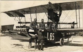 Die Fliegerhelden von Ancona. K.u.K. Kriegsmarine Seeflugzeug / WWI Austro-Hungarian Navy Lohner Te-type flying boat (hydroplane) L-65 on land, three crewmembers posing for the camera next to machine. The postcard identifies by name the "air heroes of Ancona": Linienschiffsleutnant Stenta, Seekadett Vámos, and Flugmeister Molnár. Verlag Photogr. Atelier des Roten Kreuzes, Pola 1916 (vágott / cut)