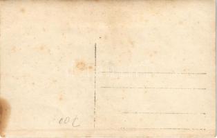 K.u.K. Kriegsmarine Seeflugzeug / large group of officers and seamen on shore and on a small pier wa...