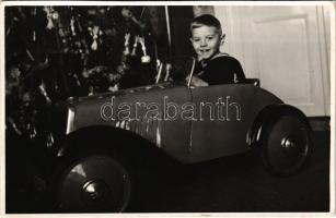 1940 Kisgyerek játékautóban karácsonykor / Boy in a toy car at Christmas. photo (non PC)