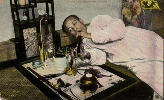 Chinaman smoking opium (EB)