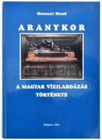 Gyarmati Dezső: Aranykor. A magyar vízilabdázás története. Bp., 2002, Herodotosz. Kartonált papírkötésben, jó állapotban. Gyarmati Dezső által dedikált.