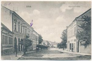 1918 Zilah, Zalau; Rákóczi utca, Tigris szálloda, Római katolikus elemi iskola, üzletek. Seres Samu kiadása / street view, hotel, Catholic elementary school, shops (kis szakadás / small tear)