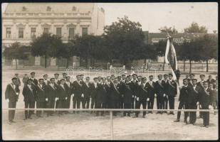 cca 1930 Cegléd(?), zászlóavatási ünnepség, vállszalagot viselő egyenruhások és népviseletbe öltözött lányok, 2 db fotólap, 13,5x8,5 cm