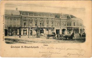 1902 Kézdivásárhely, Targu Secuiesc; Fő tér, Zalaváry Béla, Sera Imre, K. Csiszár József, Wertán Testvérek és Kovács Ferenc üzlete, lovas szekerek. Bogdán F. fényképész / main square with shops and horse carts (EK)