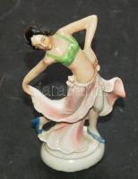 Ismeretlen jelzéssel és sorszámmal ellátott porcelán táncoslány cm-es magassággal és a szoknyánál pici sérüléssel / Porcelain dancing girl with unknown sign and serial number and with small damage on the skirt