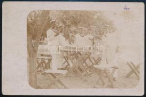 1915 Az S.M.S. Warasdiner, osztrák-magyar romboló legénysége borzik Caselnuovonál Fotólap / Sepia photo postcard An officer and a group of crewmembers of S.M.S. Warasdiner share a couple of carafes of wine in Castelnuovo. Postmarked: K.u.K. KRIEGSMARINE 23|7|15 S.M.S. MONARCH