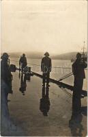 Osztrák-Magyar Haditengerészet matrózai viharkabátban a fedélzeten / K.u.K. Kriegsmarine Matrosen / Austro-Hungarian Navy mariners in oilskin on deck, a bugler blows his bugle. Stephan Vlach photo (fl)