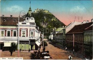 Déva, Kossuth Lajos utca, Hotel Orient szálloda, Fehér Kereszt szálloda, Minorits és Kinda, Hirsch Testvérek üzlete, vár. Hirsch Adolf kiadása / street view, hotels, shops, castle (EK)