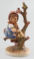 Hummel ágon ülő kislány. Jelzett, kis kopással, m: 15 cm