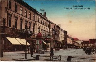 1915 Kolozsvár, Cluj; Mátyás király téri részlet, Mezőgazdasági bank, Schuster Emil üzlete, hirdetőoszlop. Kiadja Weiszfeiler Sándor / square, bank, shops, advertising column (Rb)