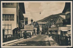 Tegernsee with automobile, parking lot, drugstore and Café Machet