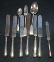 Kis ezüst evőeszköz tétel a századelőről, benne 1db villa, 1db kanál, 1db kés, összesen 240g + 6db ezüstnyelű kés